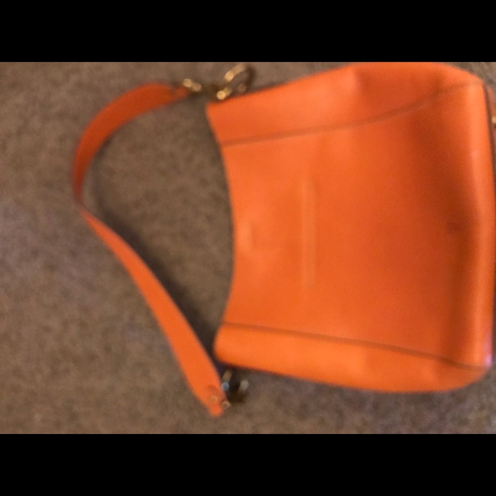 Beautiful orange fry harness hobo bucket bag